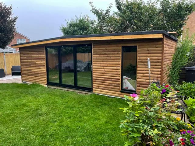 Modern timber garden room in a landscaped garden